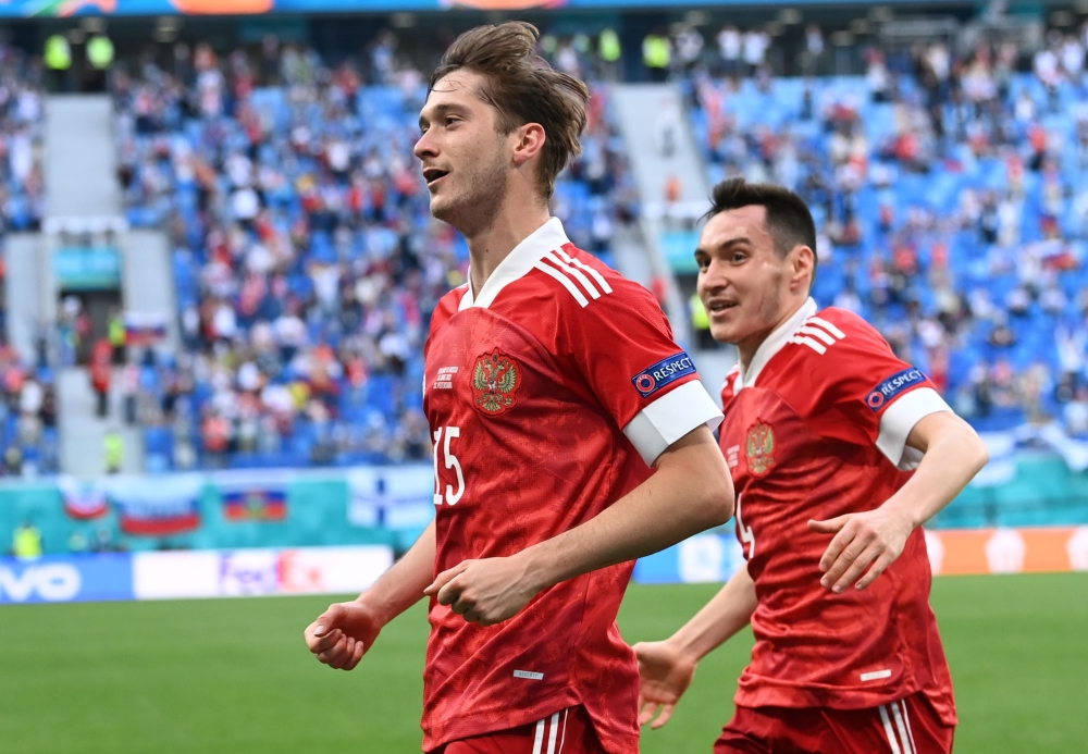 Russia's Aleksei Miranchuk celebrates scoring their first goal with Vyacheslav Karavayev Pool via REUTERS/Kirill Kudryavtsev