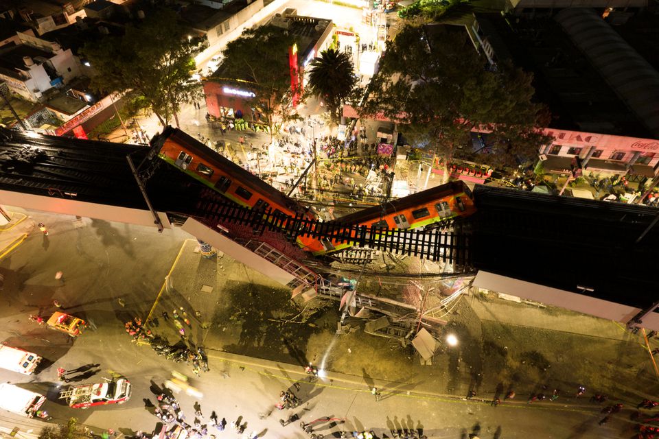 A general view of damage caused after a railway overpass and train collapsed onto a busy road in this drone picture obtained from social media Mexico City, Mexico May 4, 2021. Picture taken with a drone. INSTAGRAM @CSDRONES/via REUTERS