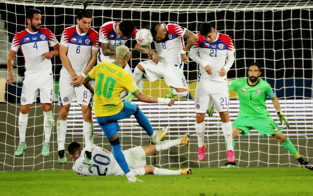 Brazil's Neymar takes a free-kick REUTERS/Sergio Moraes 