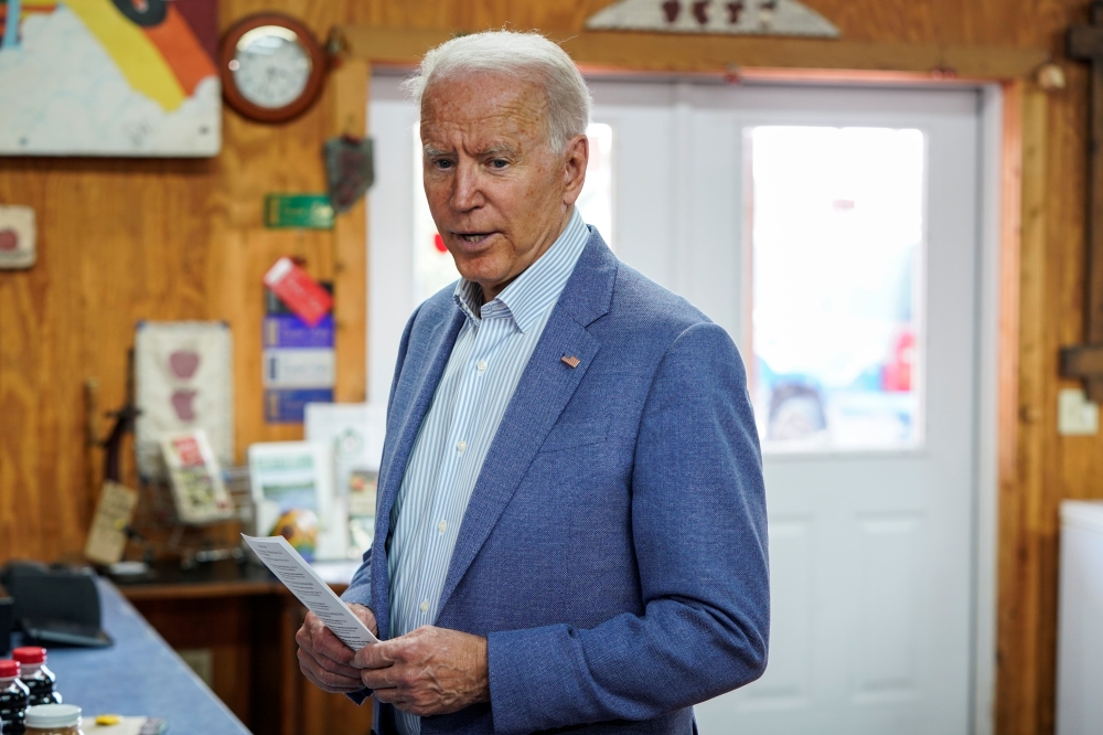 U.S. President Joe Biden speaks to the media at King Orchards in Central Lake, Michigan, U.S., July 3, 2021. REUTERS/Joshua Roberts