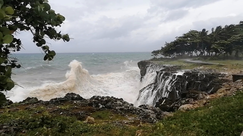 Waters churn along the rocky coastline as Tropical Storm Elsa arrives in Santo Domingo, Dominican Republic July 3, 2021 in this still image taken from social media video. Content filmed July 3, 2021. Eloy Contreras via REUTERS 