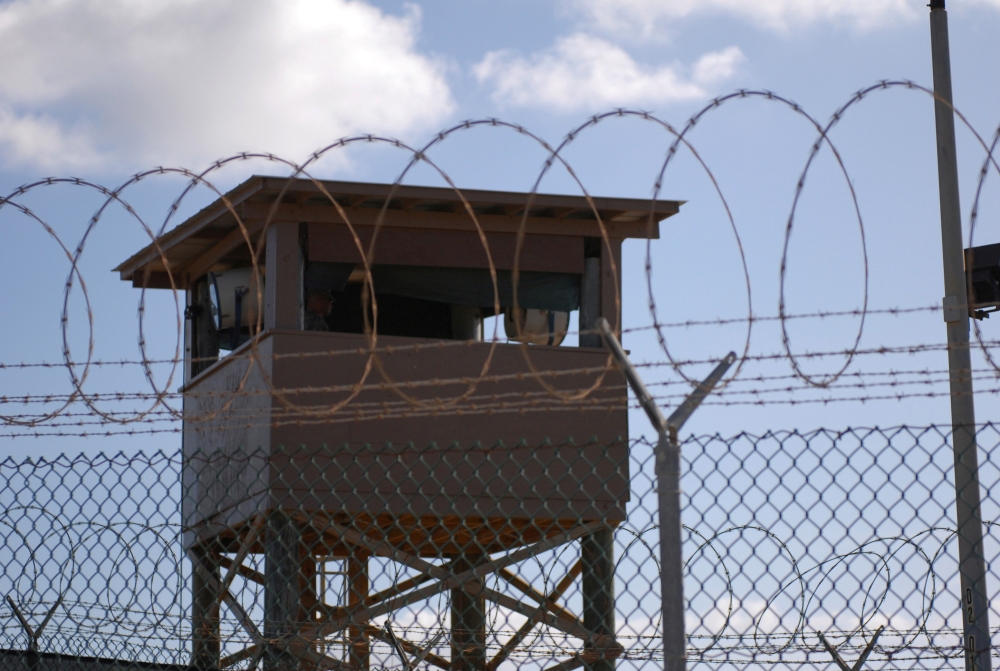 A soldier stands guard in a tower overlooking Camp Delta at Guantanamo Bay naval base in a December 31, 2009 file photo. (Reuters/US Navy)

