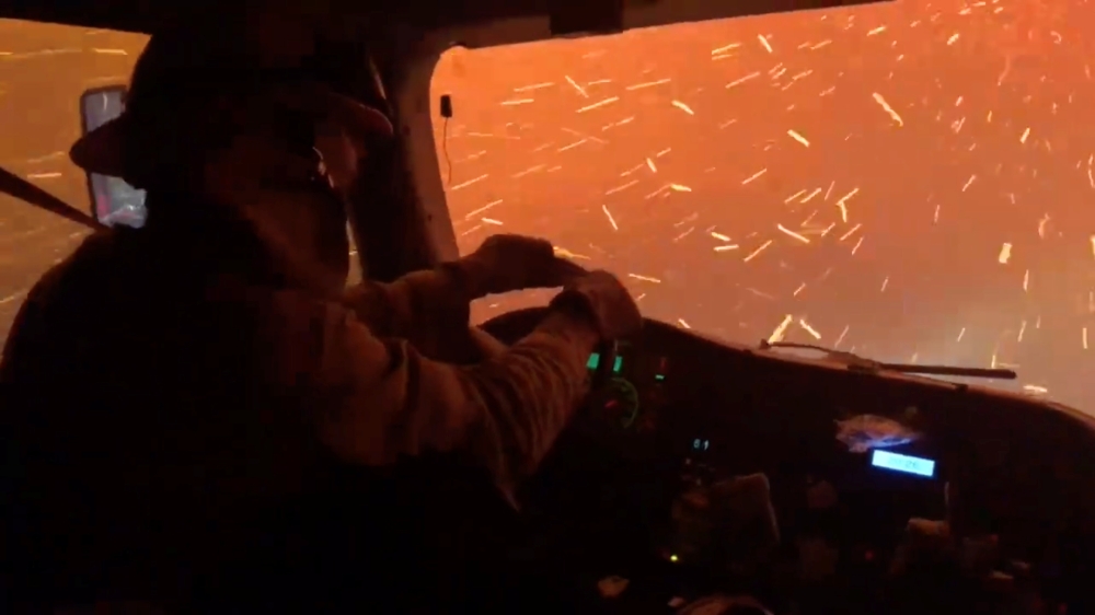 Firefighter crew drives through wildfire embers on their way to protect a housing development from the Tamarack Fire, in Douglas County, Nevada, U.S., July 21, 2021 in this still image taken from video. UC Davis Fire Dept via REUTERS
