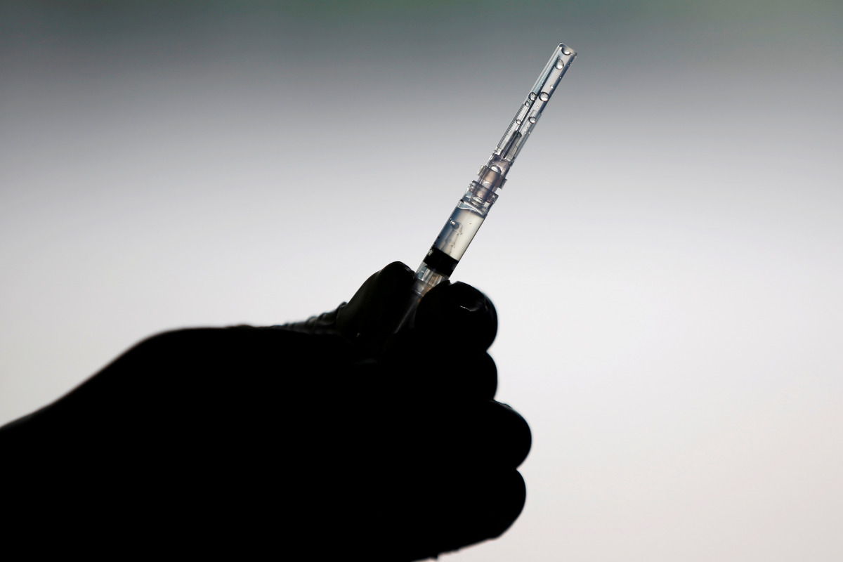 FILE PHOTO: A healthcare worker prepares a dose of China's Sinovac Biotech vaccine for the coronavirus disease in Jakarta, Indonesia, March 5, 2021. REUTERS/Willy Kurniawan/File Photo
