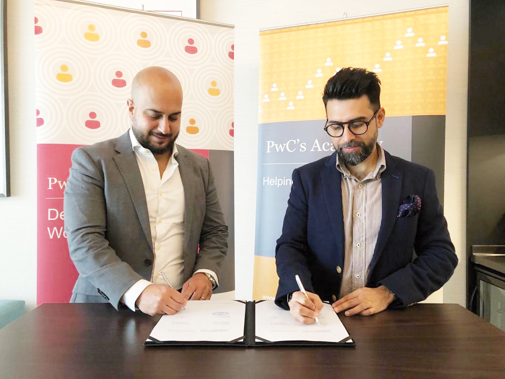 Taimur Ali Mir (right), Director of Professional Qualifications at PwC’s Academy and Zahi Bou Kamel, Senior Manager of Business Development at Wiley, during a signing ceremony recently. 