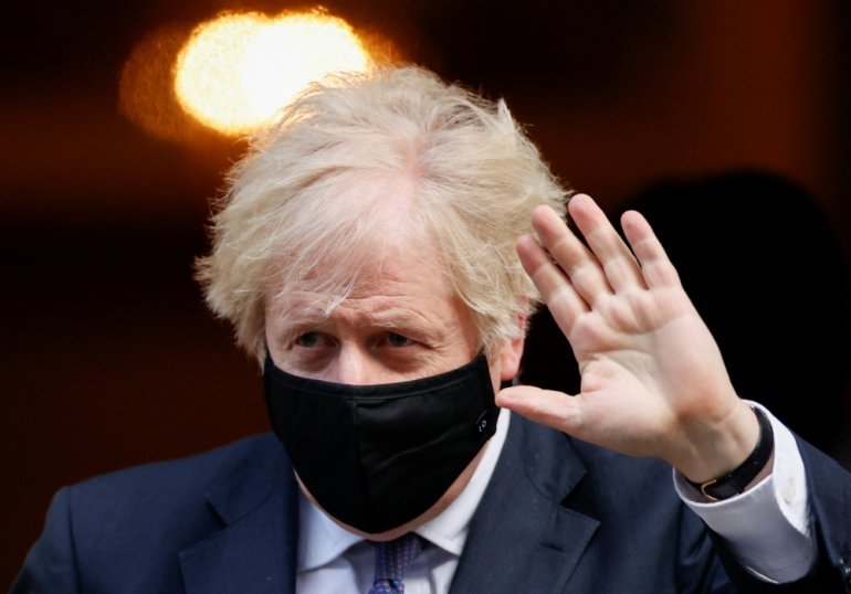 FILE PHOTO: Britain's Prime Minister Boris Johnson waves as he leaves Downing Street, in London, Britain, January 6, 2021. REUTERS/John Sibley
