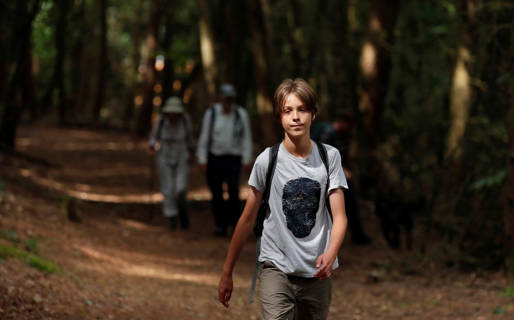 Jude Walker, 11, during his 210 miles (340 km) walk from Yorkshire to London over 21 days to raise awareness for 'the zero carbon campaign' petition, which calls for the government to implement a Carbon Tax, in Milton Keynes, Britain August 10, 2021. Pict