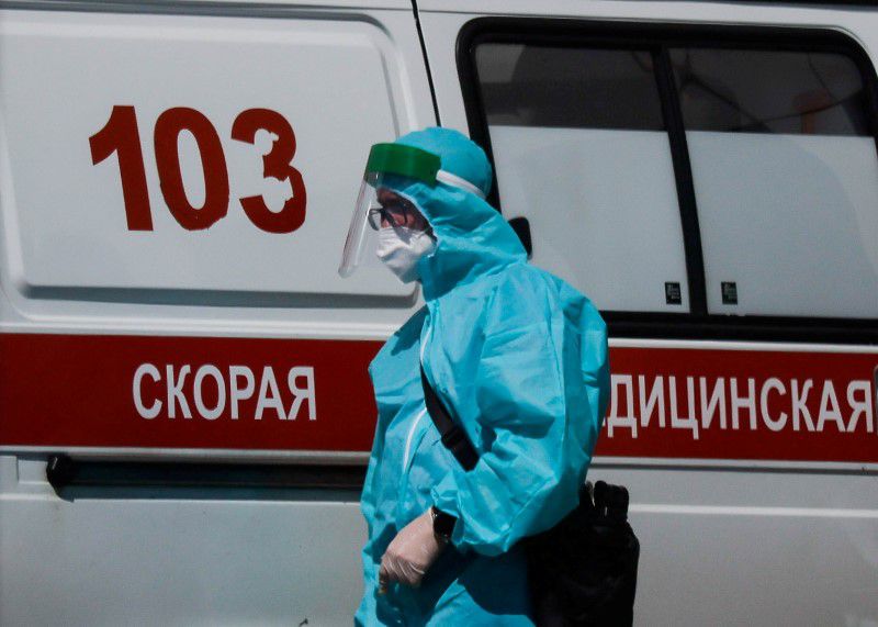 A medical specialist walks by an ambulance outside a hospital for patients infected with coronavirus disease (COVID-19) in Moscow, Russia June 16, 2021. REUTERS/Maxim Shemetov