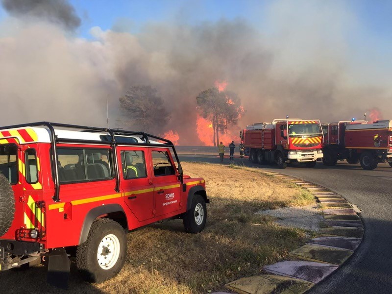 Firefighters work near a major wildfire that broke out in the Var region of southern France, August 17, 2021 SDMIS69/Handout via REUTERS