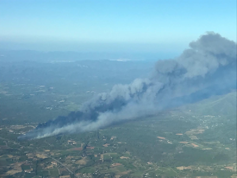 Smoke rises from a major wildfire that broke out in the Var region of southern France, August 16, 2021. Picture taken August 16, 2021. Securite Civile