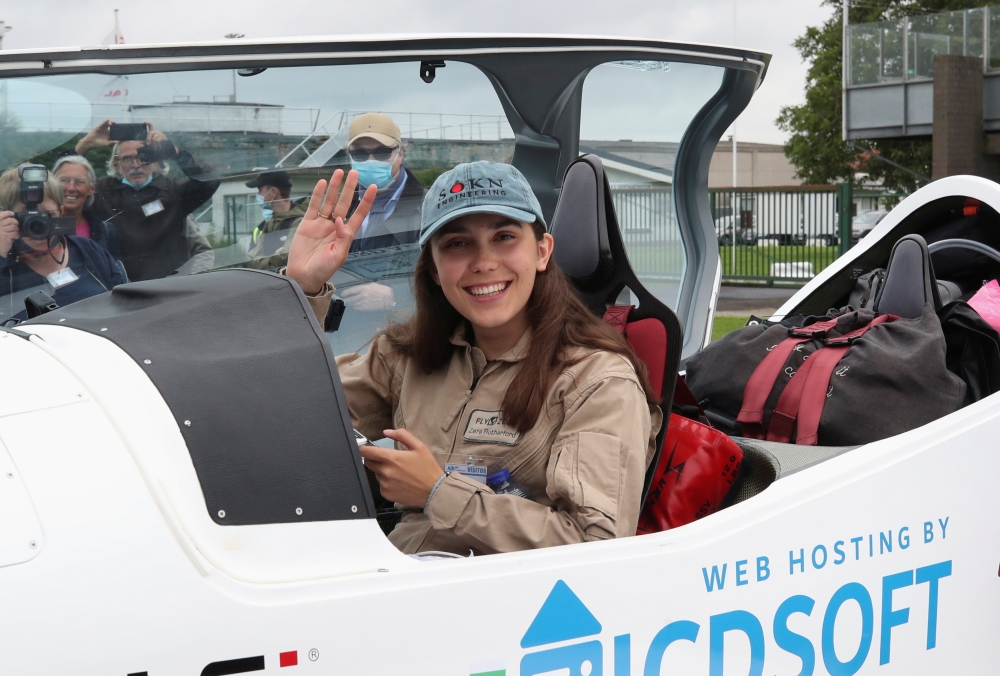 Belgian-British pilot Zara Rutherford, 19 poses for pictures before departing for a round-the-world trip in a light aircraft, aiming to become the youngest female pilot to circle the planet alone, in Wevelgem, Belgium, August 18, 2021. REUTERS/Yves Herman