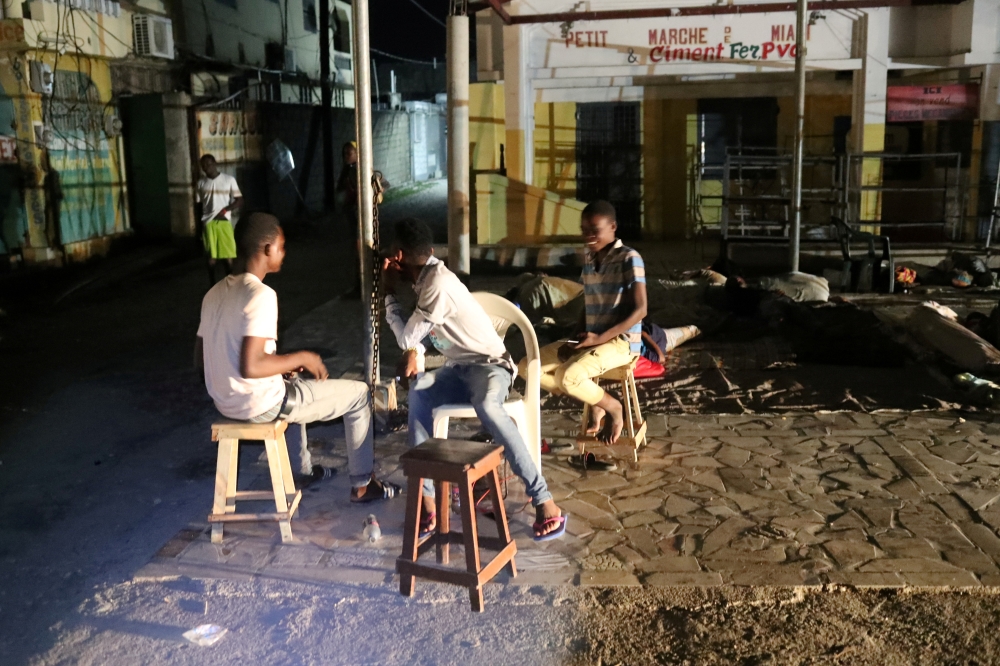 People are seen outside their home after tremors shook buildings, following Saturday's earthquake in Les Cayes, Haiti August 18, 2021. Reuters/Henry Romero