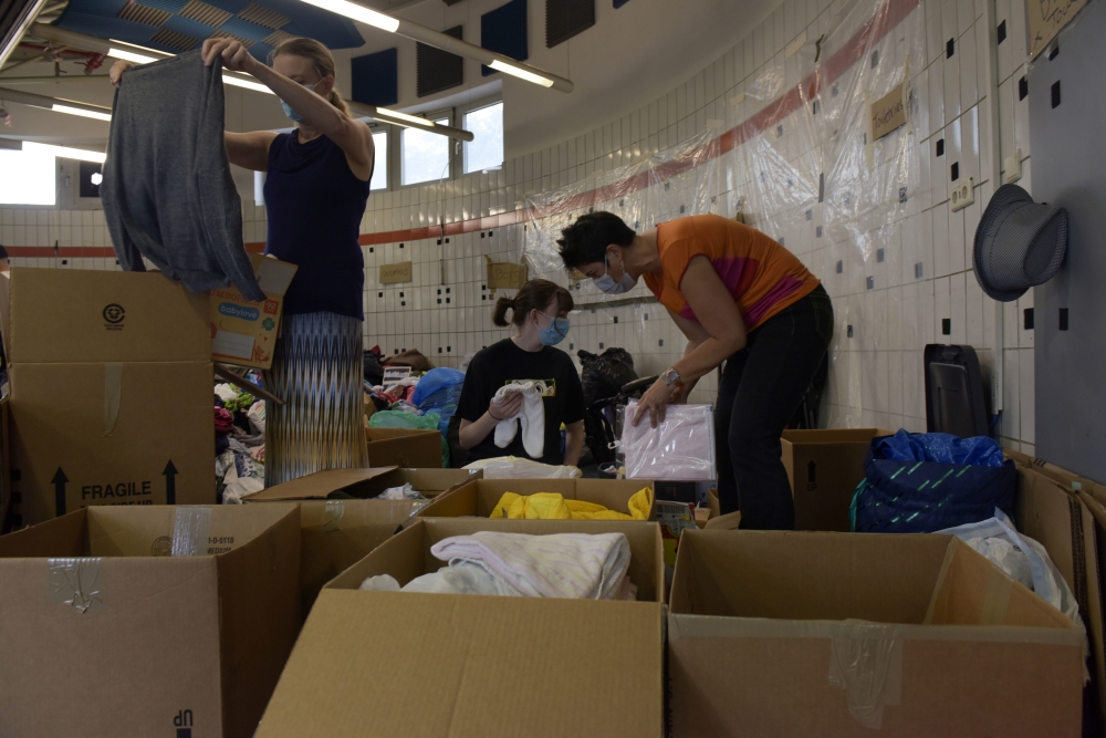 Civilian volunteers sort donations for evacuees from Afghanistan at Ramstein Air Base, Germany, August 22, 2021. Picture taken August 22, 2021. Airman 1st Class Madelyn Keech/U.S. Air Force