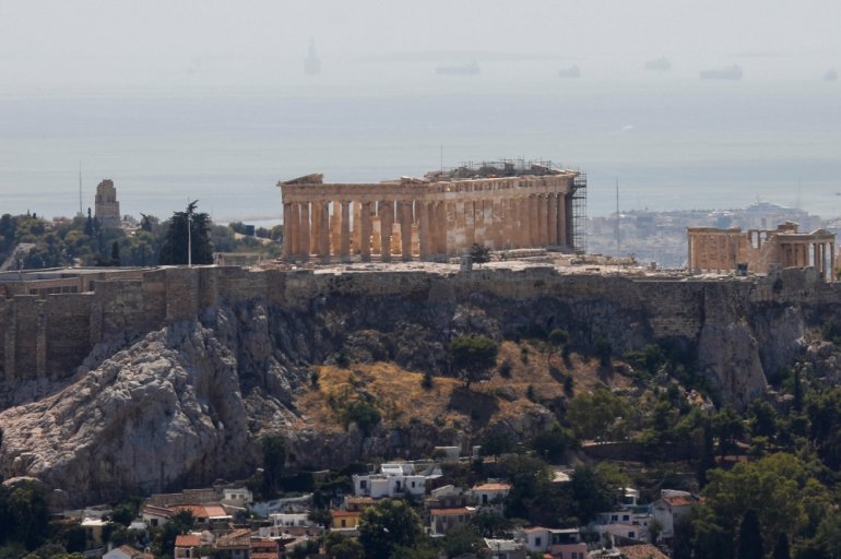 The Parthenon temple is seen atop the empty Acropolis hill archaeological site, closed to the public during a heatwave in Athens, Greece, July 30, 2021. REUTERS/Costas Baltas
