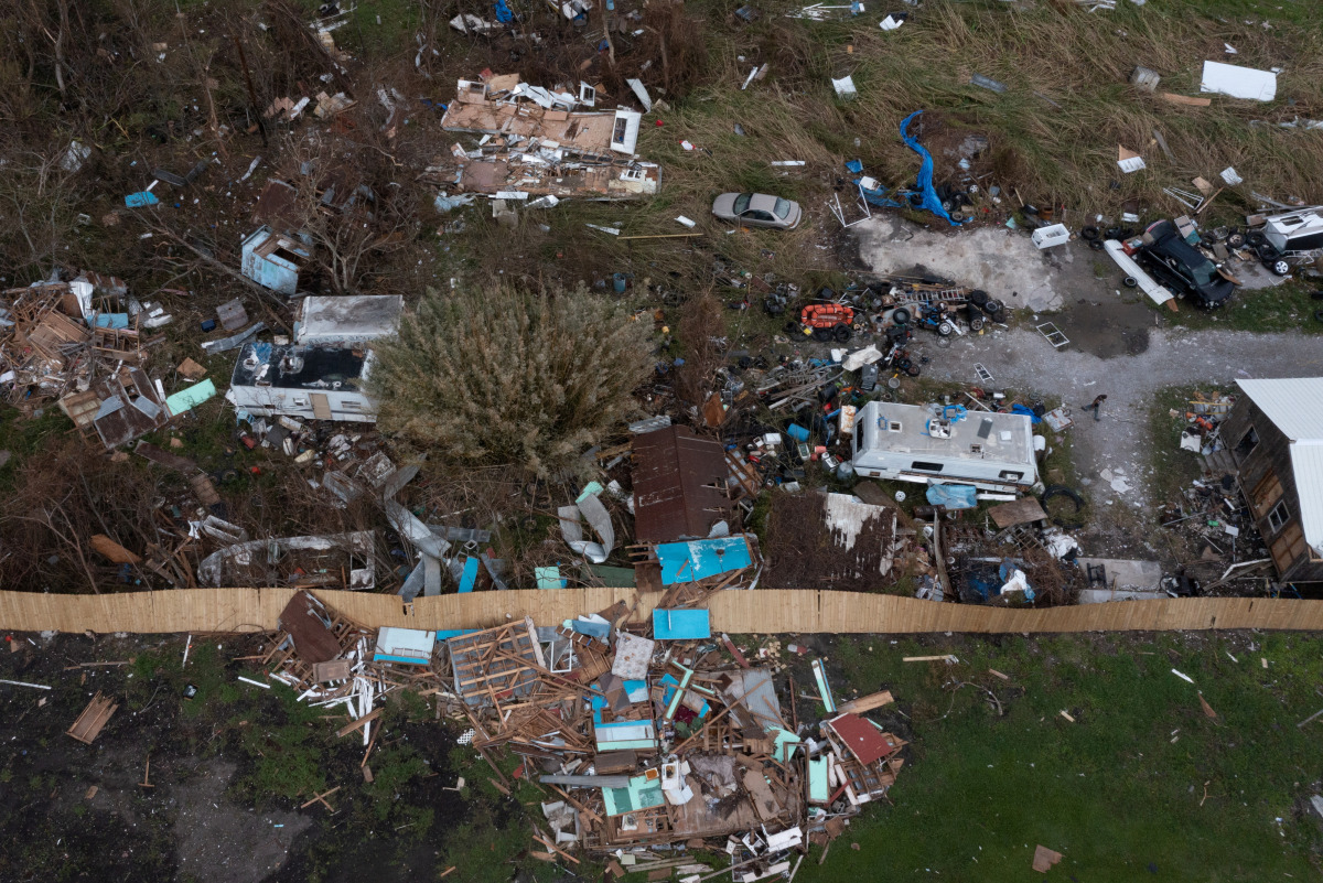 A man surveys his property in the aftermath of Hurricane Ida in Golden Meadow, Louisiana, U.S., September 1, 2021. Picture taken with a drone. REUTERS/Adrees Latif
