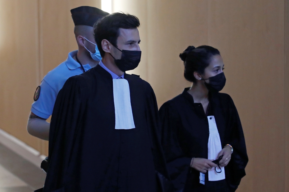 Olivia Ronen and Martin Vettes, lawyers of Salah Abdeslam, arrive for the start of the trial of the Paris' November 2015 attacks at the Paris courthouse on the Ile de la Cite, in Paris, France, September 8, 2021. Reuters/Gonzalo Fuentes