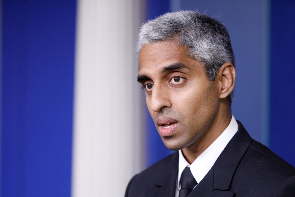 FILE PHOTO: United States Surgeon General Vivek Murthy delivers remarks during a news conference with White House Press Secretary Jen Psaki at the White House in Washington, U.S., July  15, 2021. REUTERS/Tom Brenner/File Photo
