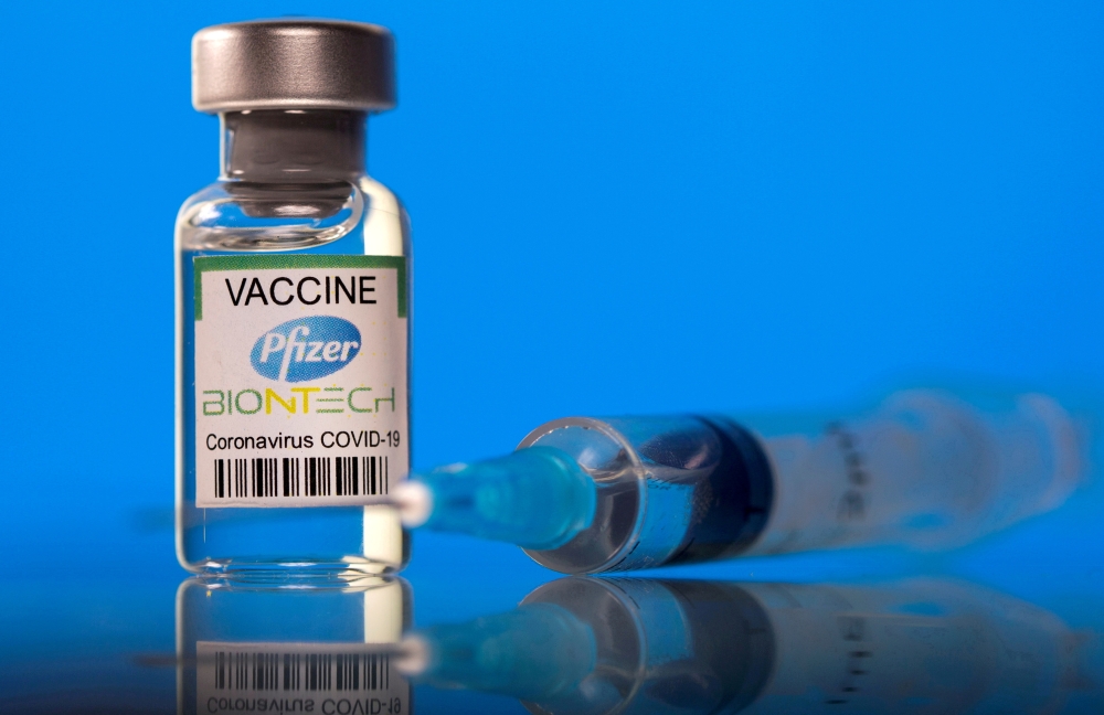 File photo: A vial labelled with the Pfizer-BioNTech coronavirus disease (COVID-19) vaccine is seen in this illustration picture taken March 19, 2021. REUTERS/Dado Ruvic/Illustration/File Photo