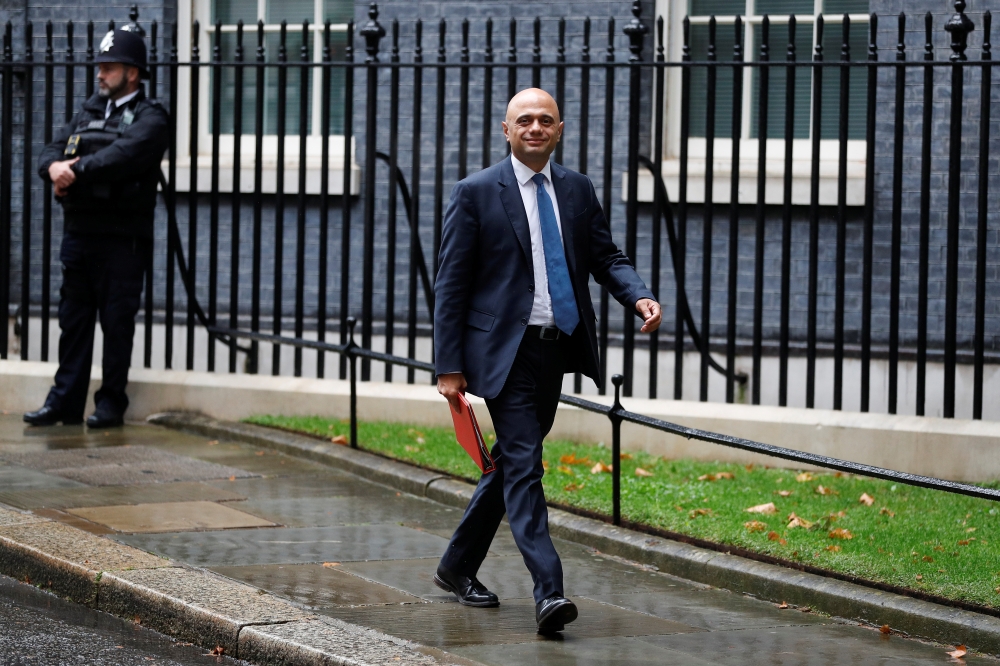 Britain's Health Secretary Sajid Javid walks outside Downing Street in London, Britain, September 14, 2021. REUTERS/Peter Nicholls