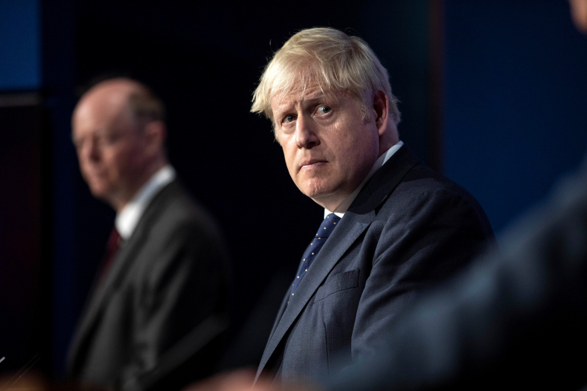 Britain's Prime Minister Boris Johnson looks on during a news conference on the coronavirus disease (COVID-19) in the Downing Street Briefing Room, London, Britain September 14, 2021. Richard Pohle/Pool via REUTERS
