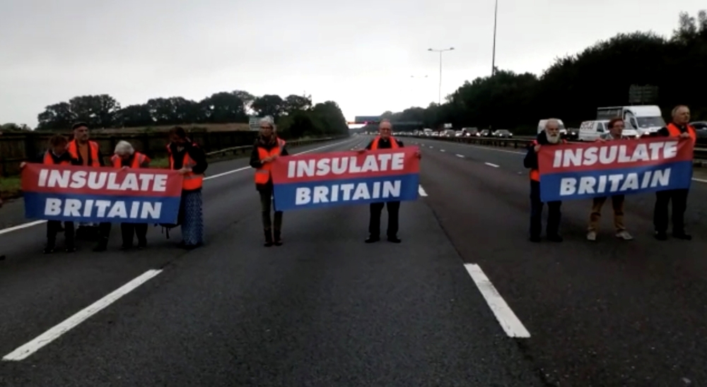 Members of Insulate Britain protest on M25 Motorway, Britain September 15, 2021, in this still image taken from a handout video. Insulate Britain/Handout via Reuters