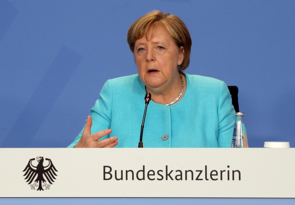 German Chancellor Angela Merkel attends a news conference after talks with directors of the ILO, IMF, OECD, World Bank and more to discuss questions on the current state of the global economic situation, in Berlin, Germany August 26, 2021. Wolfgang Kumm/P