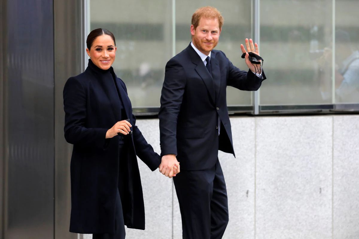 Britain's Prince Harry and Meghan, Duke and Duchess of Sussex, wave while visiting the 9/11 Memorial in Manhattan, New York City, U.S., September 23, 2021. REUTERS/Andrew Kelly