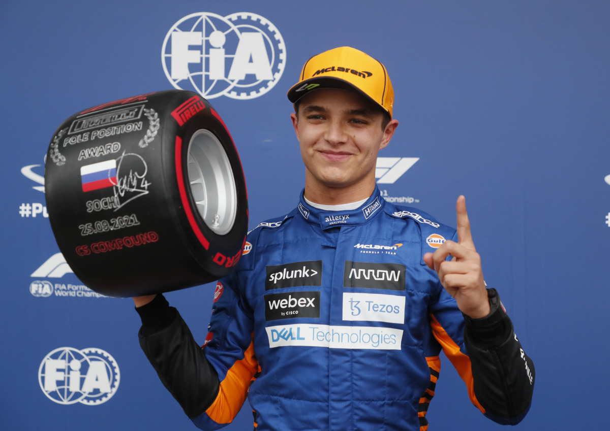McLaren's Lando Norris celebrates pole position after qualifying Pool via REUTERS/Yuri Kochetkov
