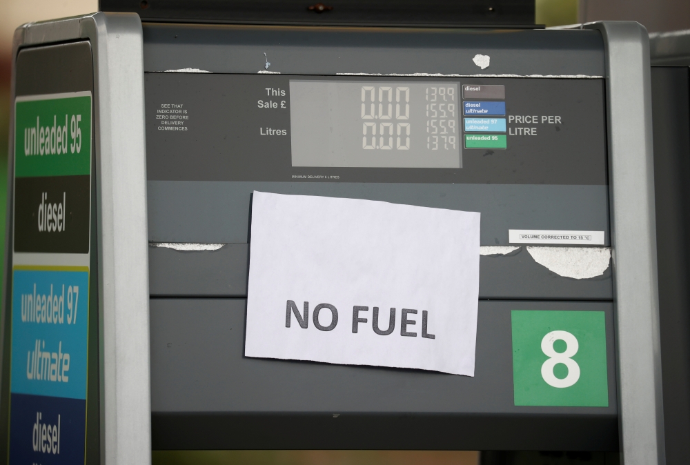 A 'No Fuel' sign is attached to an empty petrol pump at a BP filling station in Manchester, Britain, September 28, 2021. Reuters/Phil Noble