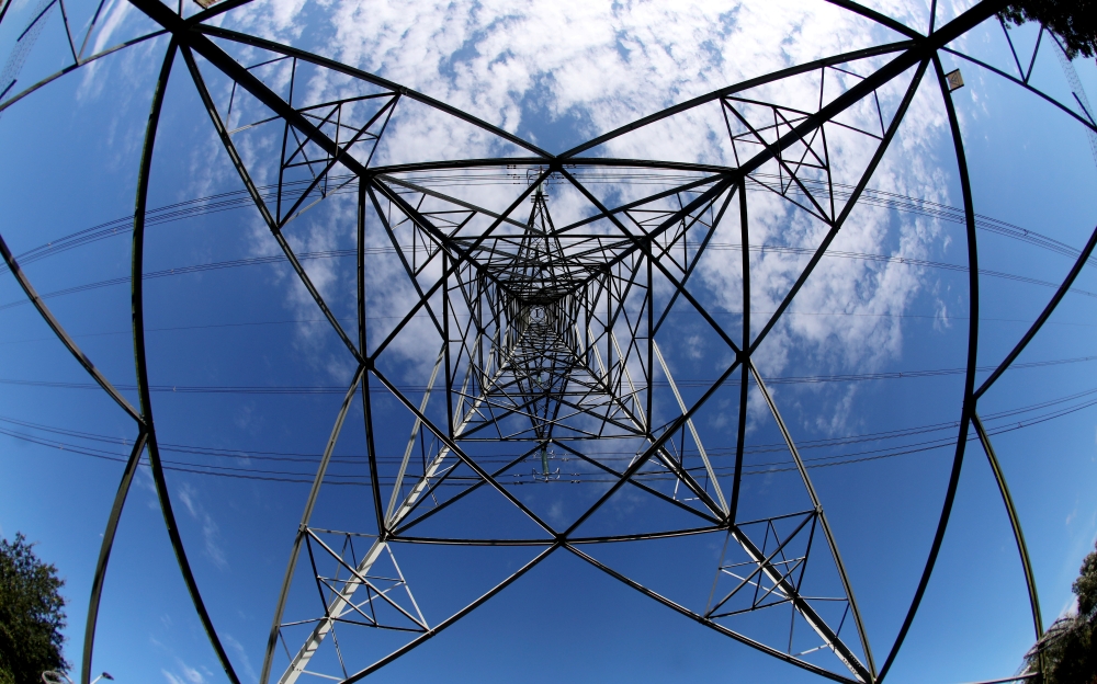 General view of an electricity pylon near Ellesmere Port, Britain, September 27, 2021. Reuters/Phil Noble/File Photo