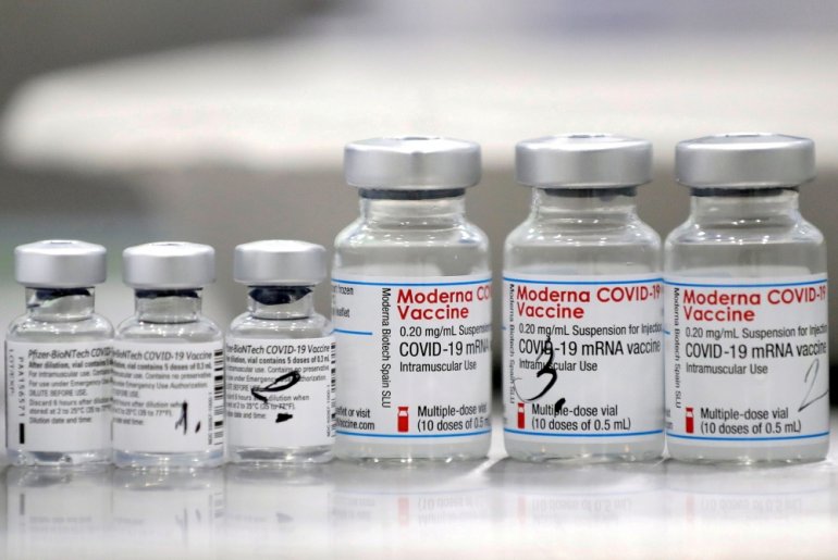 Vials of coronavirus disease (COVID-19) vaccines of Pfizer-BioNTech and Moderna are seen in the town of Ricany near Prague, Czech Republic, February 25, 2021. REUTERS/David W Cerny/File Photo
