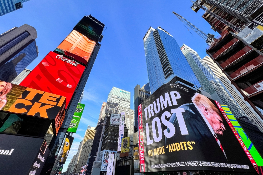 A billboard showing former U.S. President Donald Trump is seen in Times Square in the Manhattan borough of New York on October 14, 2021. (REUTERS/Eduardo Munoz)