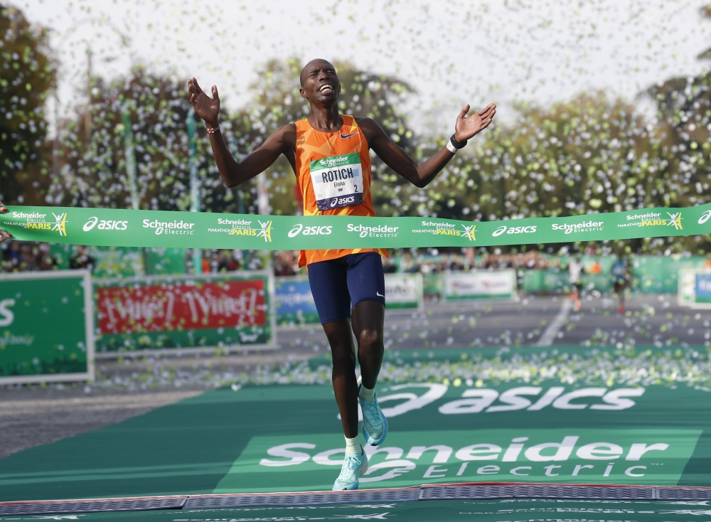 Kenya’s Elisha Rotich celebrates after winning the elite men's race and setting a new record Reuters/Gonzalo Fuentes
