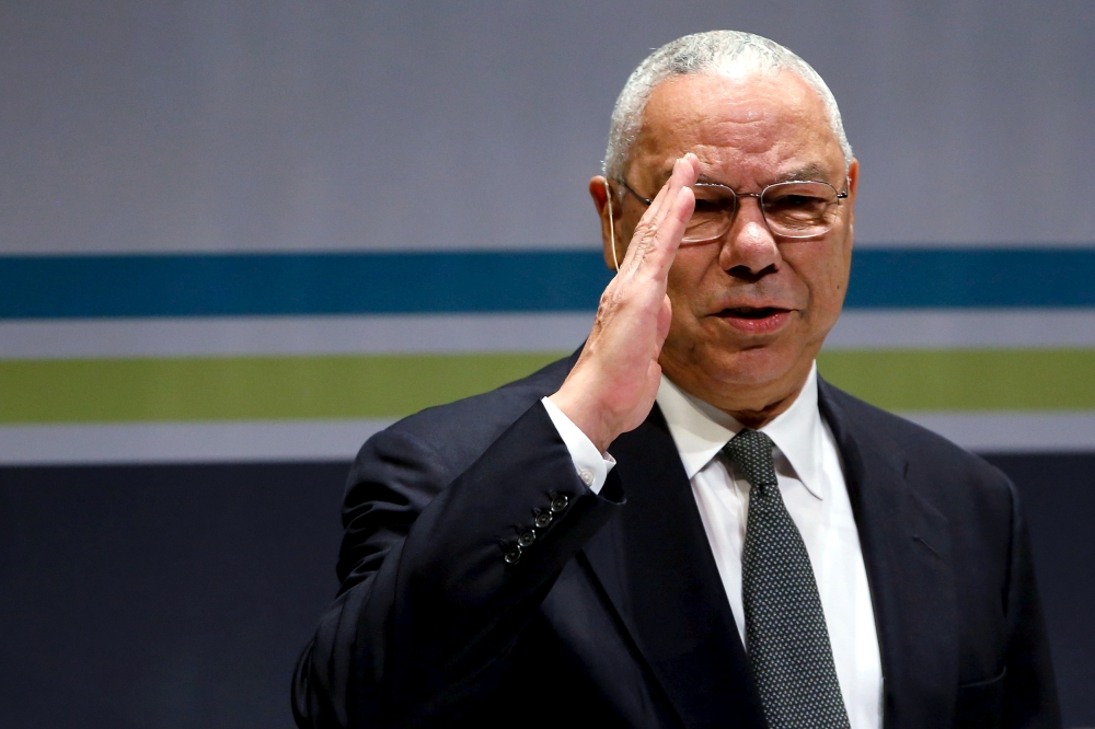 Former U.S. Secretary of State Colin Powell salutes the audience as he takes the stage at the Washington Ideas Forum in Washington, September 30, 2015. REUTERS/Jonathan Ernst/File Photo