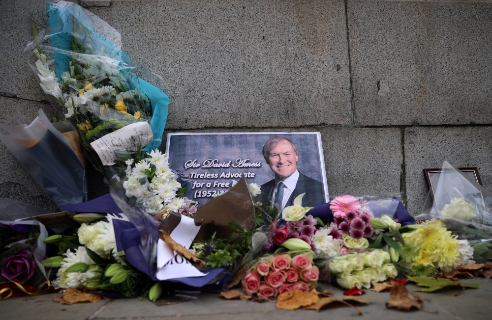 File photo: Floral tributes to British MP David Amess, who was stabbed to death during a meeting with constituents, lay outside the Houses of Parliament, in London, Britain, October 19, 2021. Reuters/Hannah McKay/File Photo