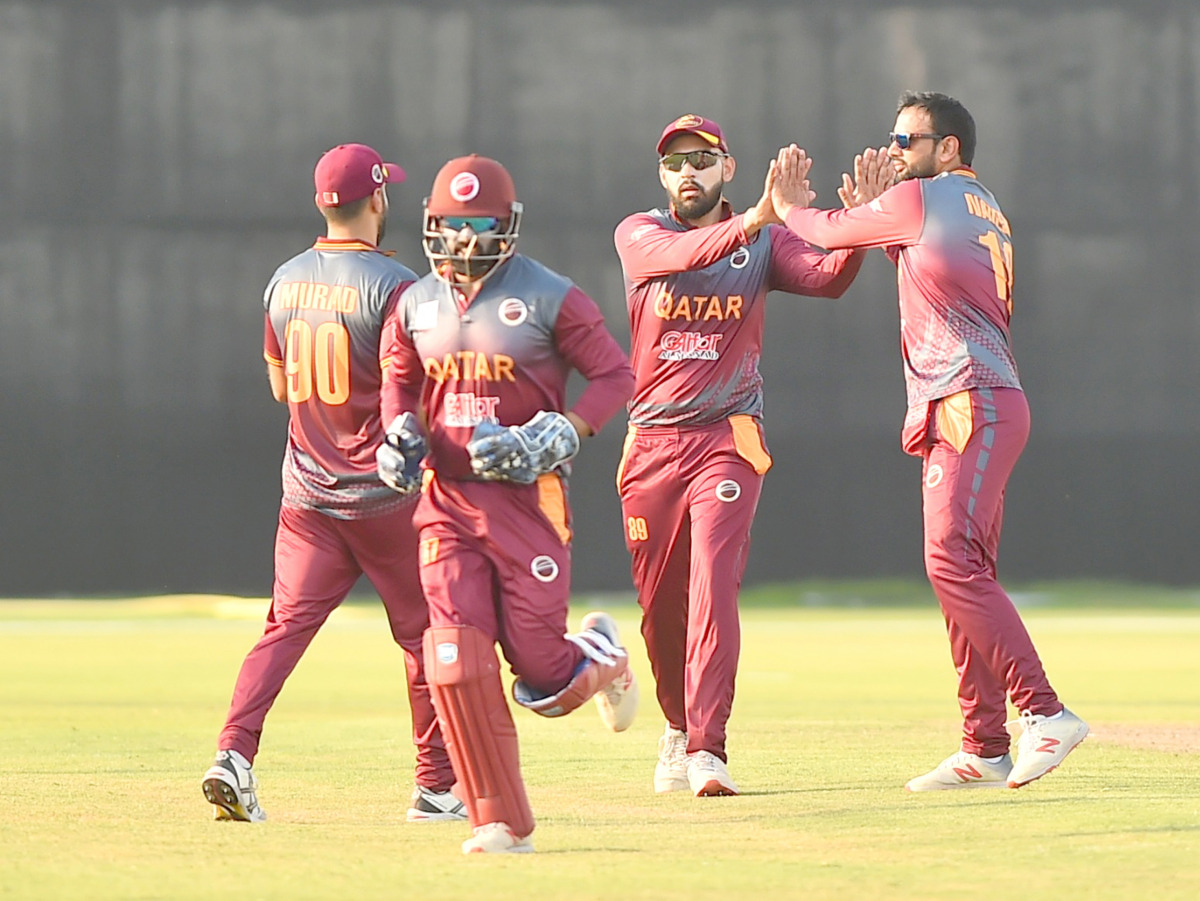 Qatar players celebrate after taking a wicket. Pictures: Abdul Basit / The Peninsula 


