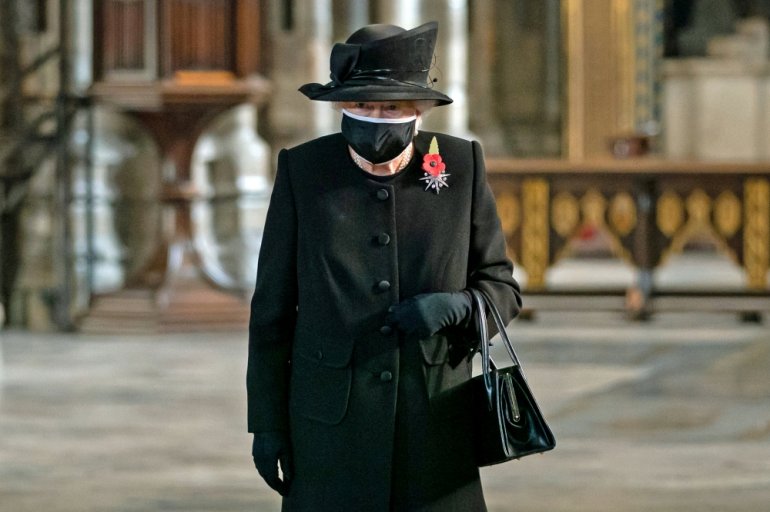 FILE PHOTO: Queen Elizabeth attends a ceremony in London's Westminster Abbey to mark the centenary of the burial of the Unknown Warrior, in Britain November 4, 2020. Picture taken November 4, 2020. Aaron Chown/Pool via REUTERS