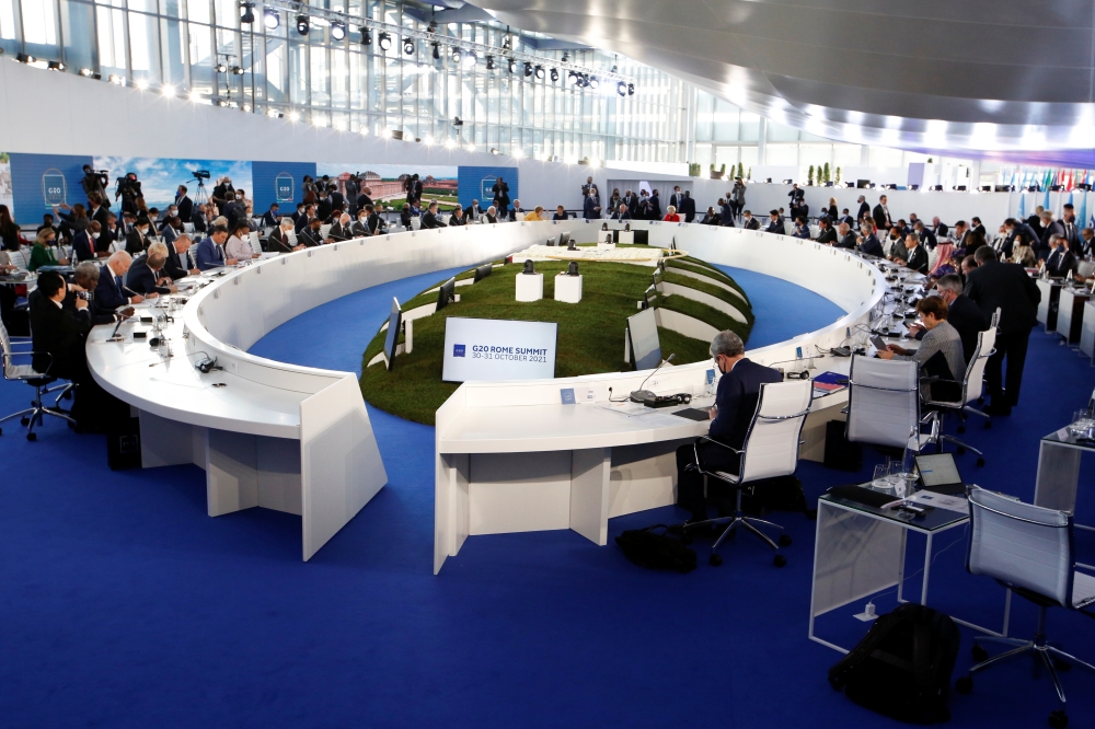 General view shows leaders attending a roundtable meeting during the G20 summit in Rome, Italy, October 30, 2021. Reuters/Remo Casilli