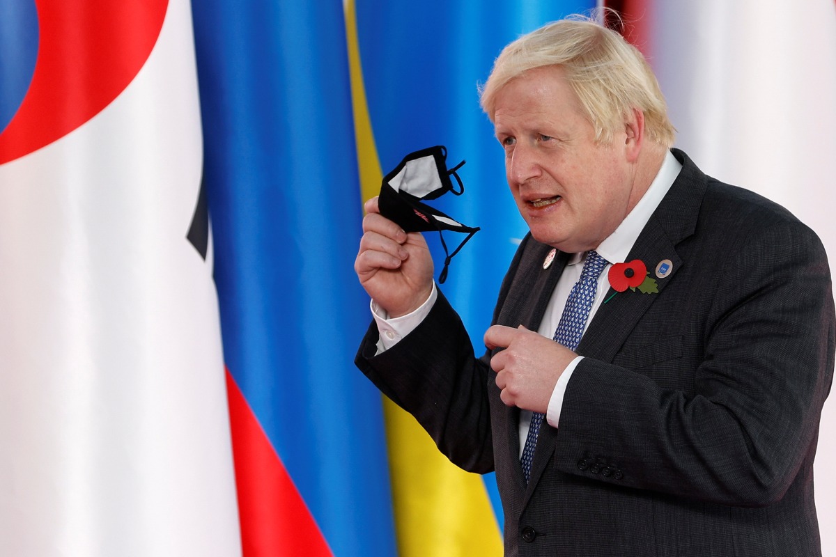 United Kingdom's Prime Minister Boris Johnson arrives for the G20 leaders summit in Rome, Italy October 30, 2021. REUTERS/Guglielmo Mangiapane
