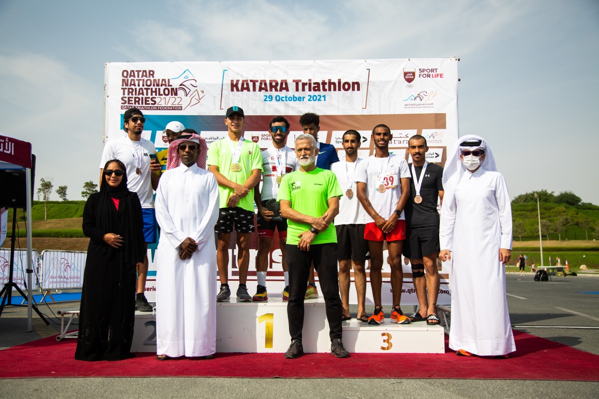 Winners of the team relay with officials during the presentation ceremony.