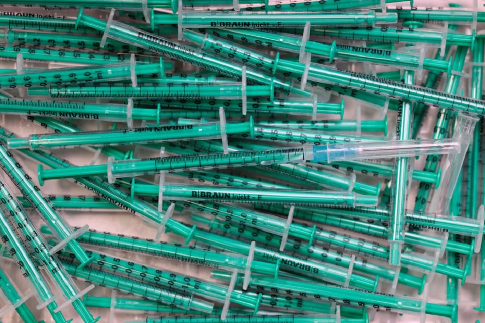 Empty syringes are pictured after a coronavirus disease (COVID-19) vaccination at a doctor's office in Berlin, Germany, November 2, 2021. REUTERS/Hannibal Hanschke

