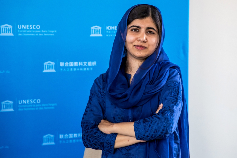 :FILE PHOTO: Nobel Peace Prize laureate Malala Yousafzai poses for photographs during the Education and Development G7 Ministers Summit in Paris, France, July 5, 2019. Christophe Petit Tesson/Pool via REUTERS/File Photo

