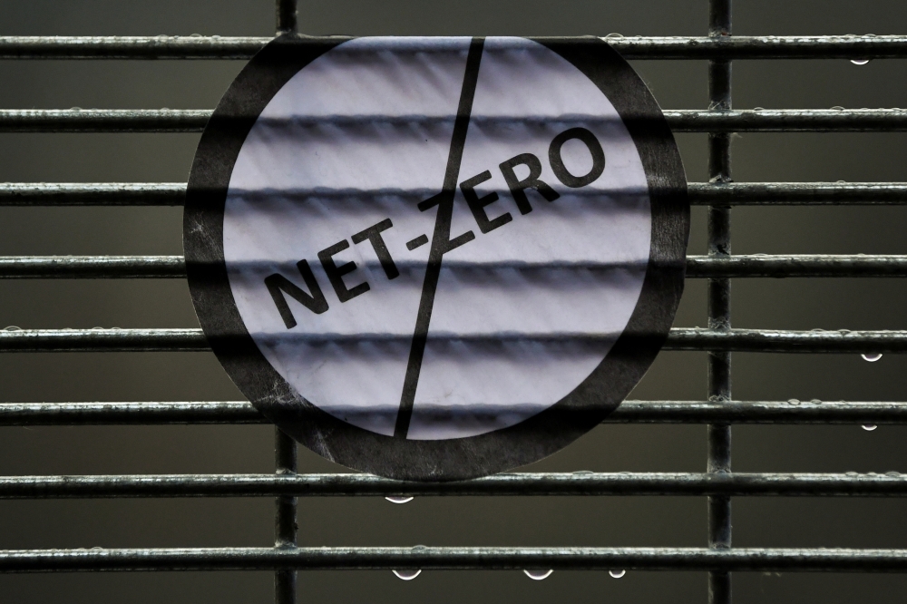 A sticker placed on a fence is seen during the UN Climate Change Conference (COP26) in Glasgow, Scotland, Britain November 12, 2021. Reuters/Dylan Martinez
 