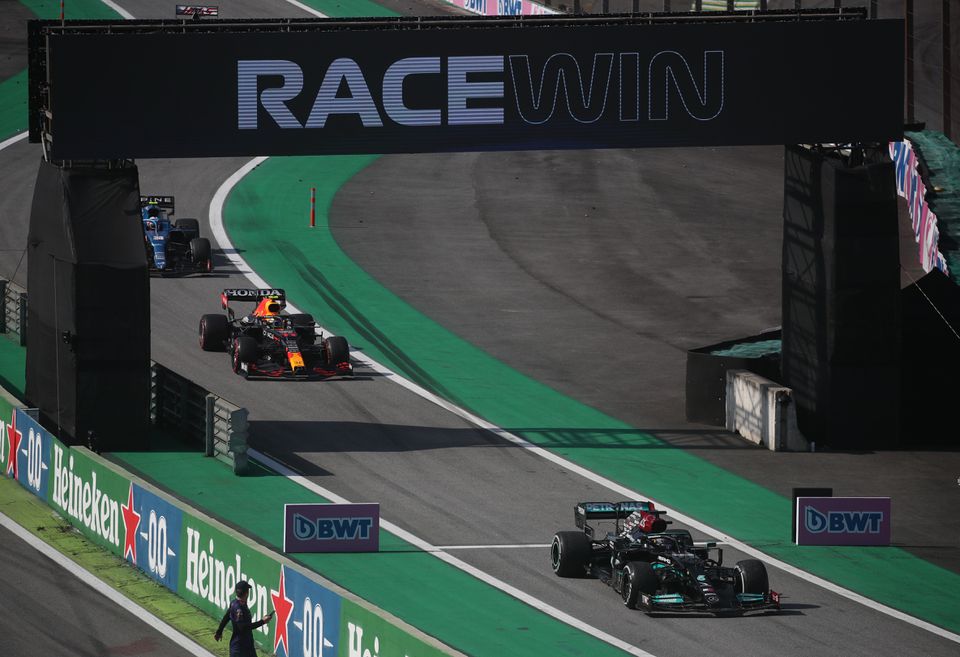 Mercedes' Lewis Hamilton crosses the finish line to win the race REUTERS/Ricardo Moraes