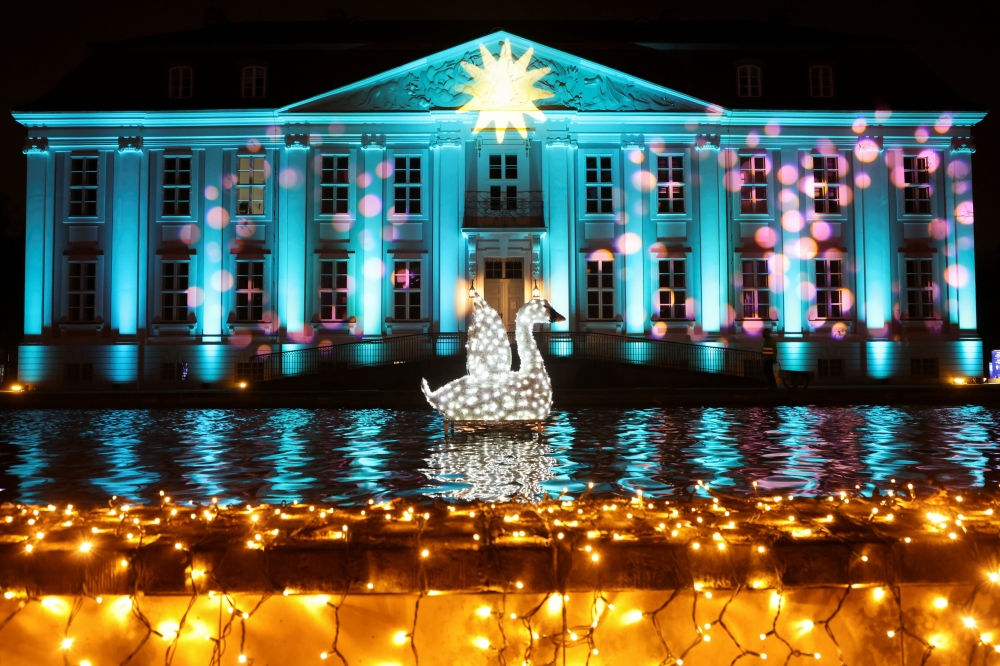 The illuminated building of Schloss Friedrichsfelde is seen during the Christmas Garden event at Tierpark zoo in Berlin, Germany, November 17, 2021. Reuters/Fabrizio Bensch