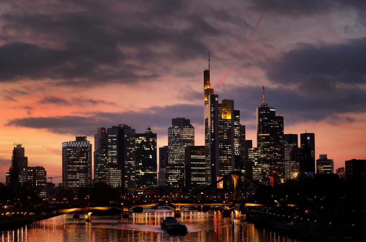 The skyline with its office buildings and the banking district are photographed during sunset as the spread of the coronavirus disease (COVID-19) continues and the German government plans new pandemic control measures in Frankfurt, Germany, November 18, 2021. REUTERS/Kai Pfaffenbach
