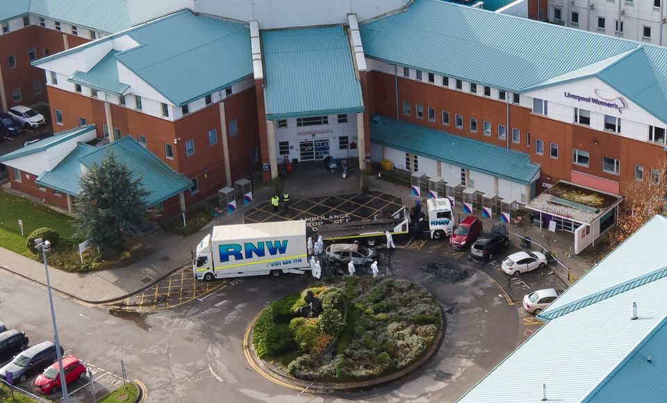 Police forensic officers stand near the remains of a taxi that exploded outside Liverpool Women's Hospital in Liverpool, Britain, November 17, 2021. Picture taken with a drone. REUTERS/Phil Noble


