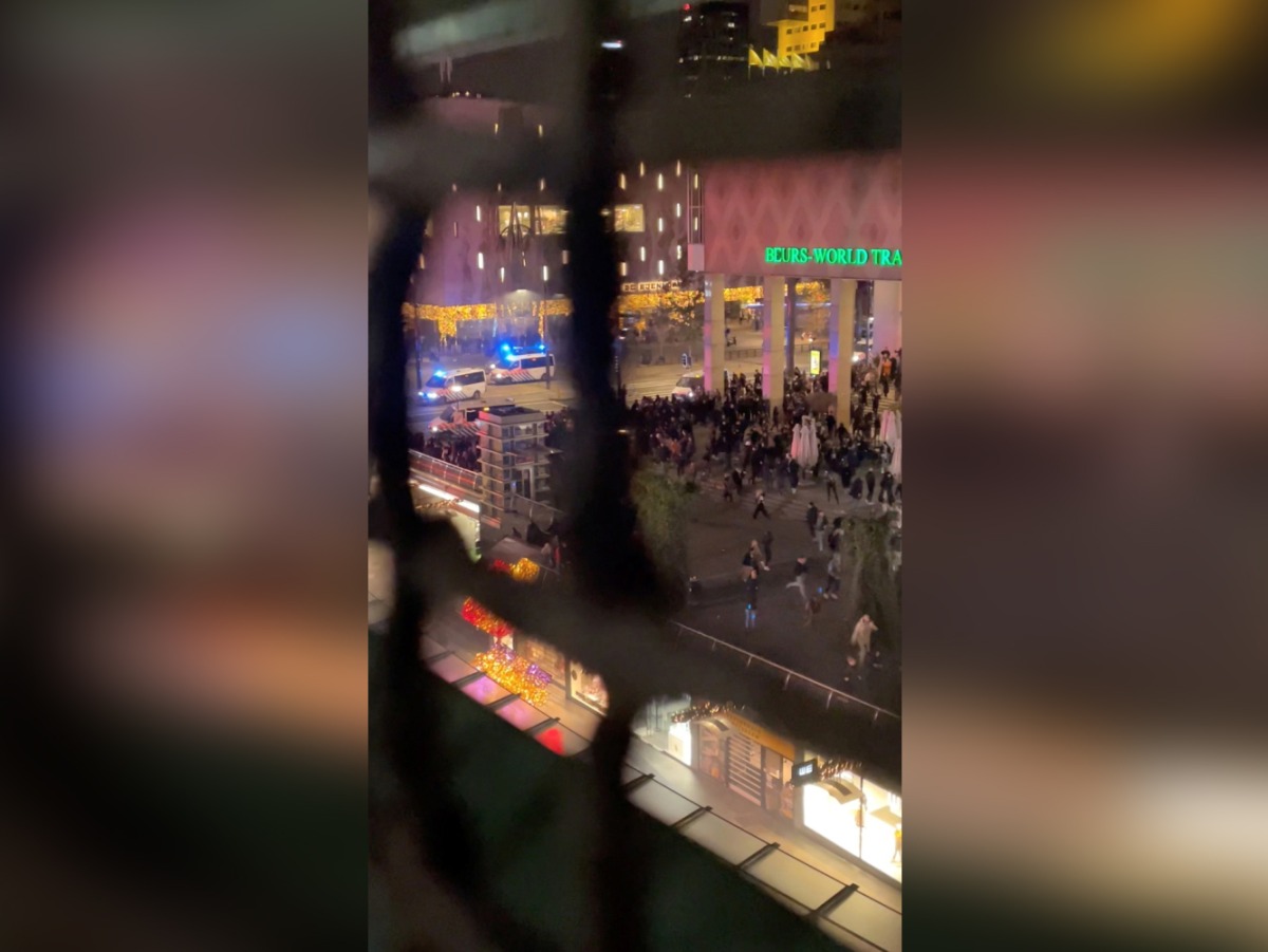 Police vehicles are seen near protesters during demonstrations against coronavirus disease (COVID-19) measures which turned violent in Rotterdam, Netherlands, November 19, 2021, in this still image obtained from video provided on social media. 
