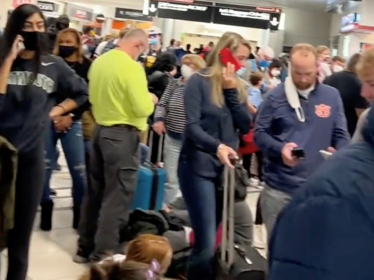 People gather to leave Hartsfield-Jackson Atlanta International Airport after reported shooting, in Atlanta, Georgia, U.S., November 20, 2021, in this still image obtained from a social media video. Twitter/mohiterajas/via Reuters
