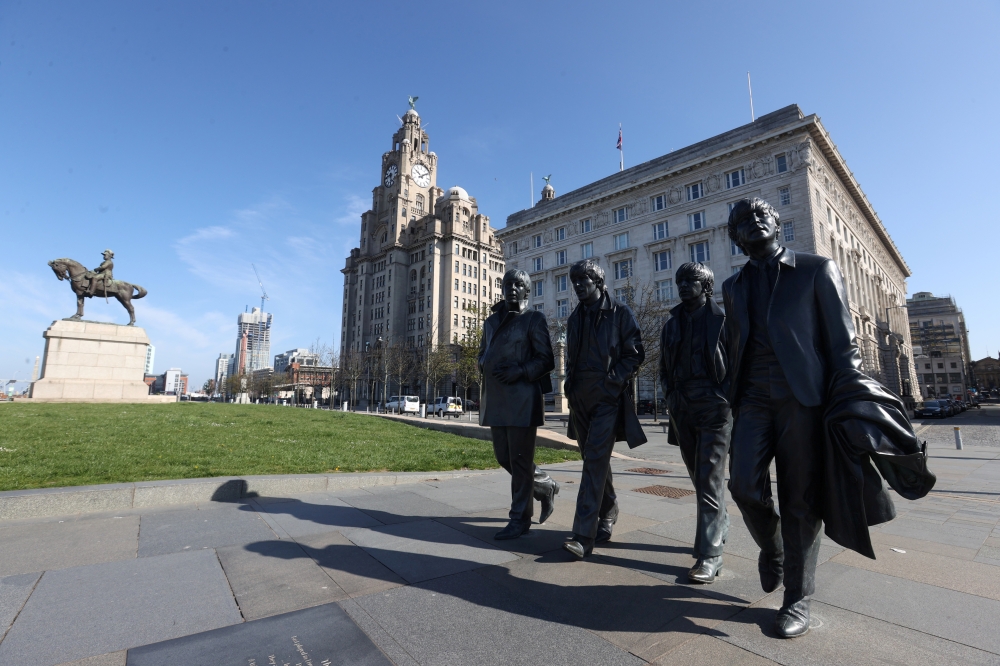 A statue of the Beatles is seen in Albert Dock as the spread of the coronavirus disease (COVID-19) continues, Liverpool, Britain, April 14, 2020. REUTERS/Carl Recine/File Photo
 